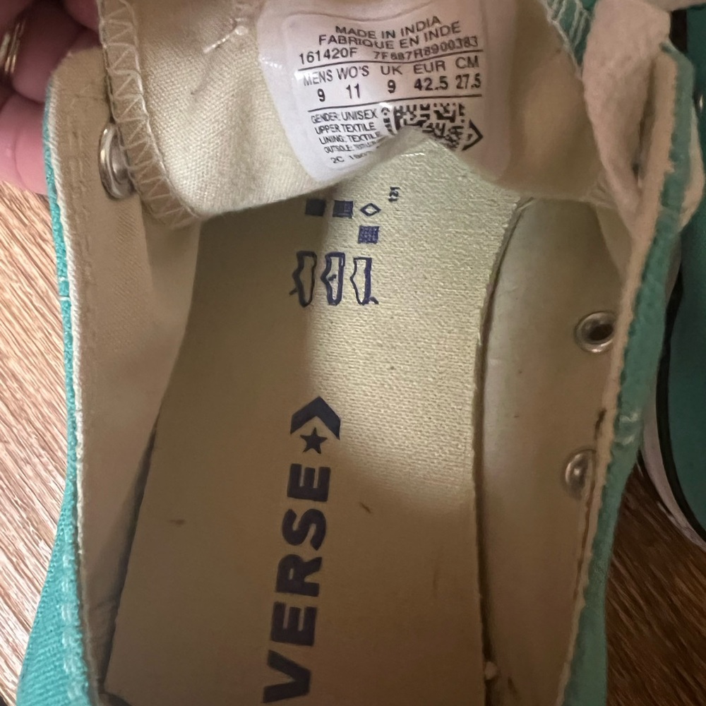 Teal Converse tennis shoes. Maybe worn one time.